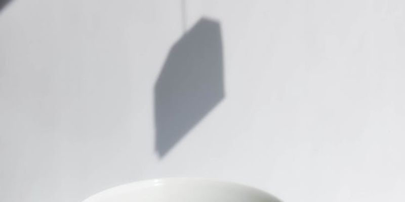 Early morning light streaming into an empty minimalist studio.