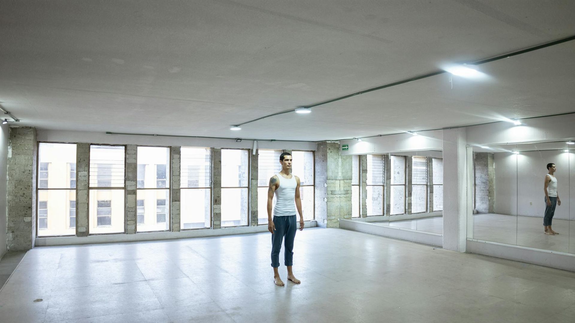 Spacious modern studio with calm ambient lighting for workouts.